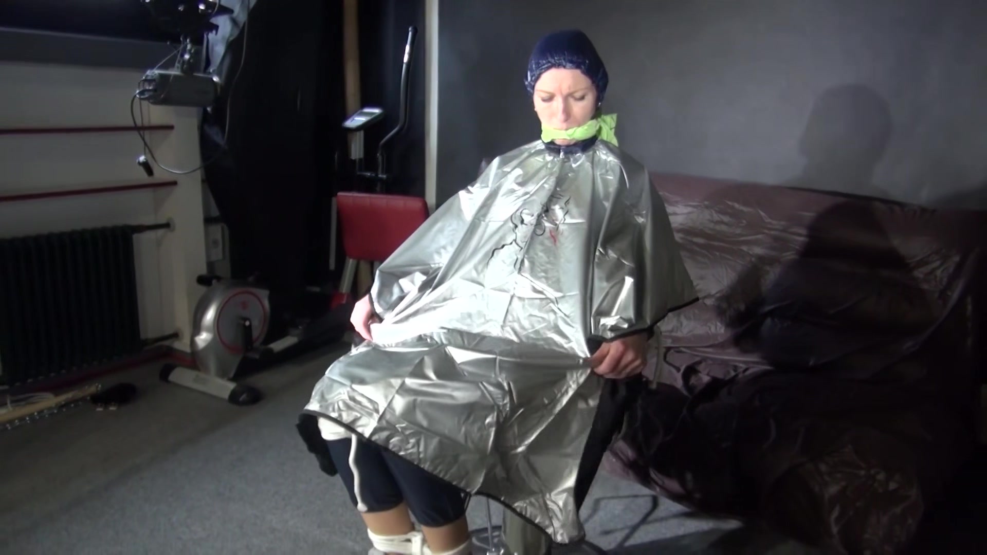 Sexy Ronja Being Tied, Gagged And Hooded On A Chair With A Clothgag Wearing Sexy Blue Shiny Nylon Rainwear (Video)