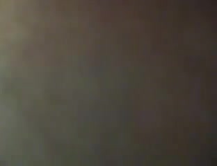 Amateur couple making out in a dressing cabin