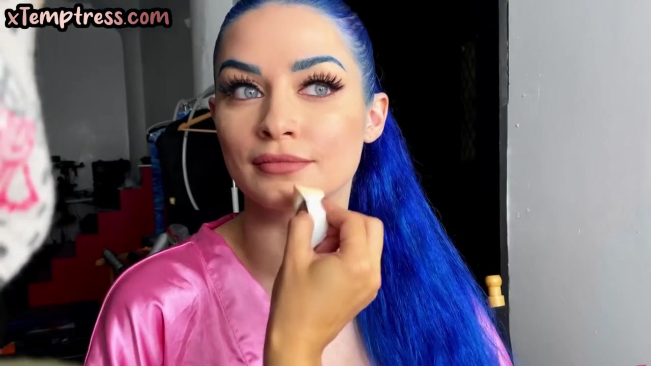 Busty colored hair babe toying pussy while sucking dildo