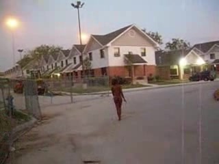 Curly black slut walks naked around the neighborhood