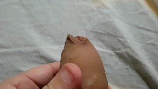 Slowly pulling back my foreskin
