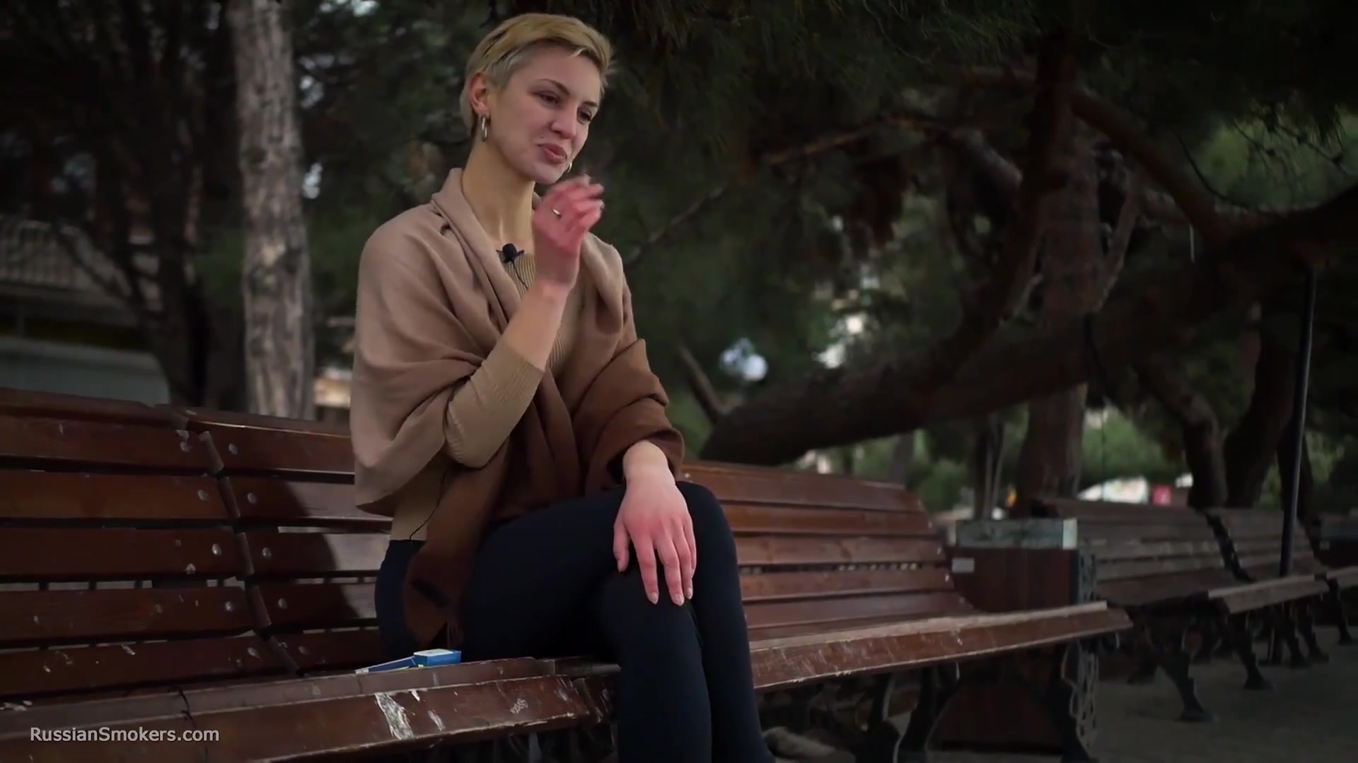 Short Cut Hair Blonde Girl Is Smoking All White 120mm Cigarettes