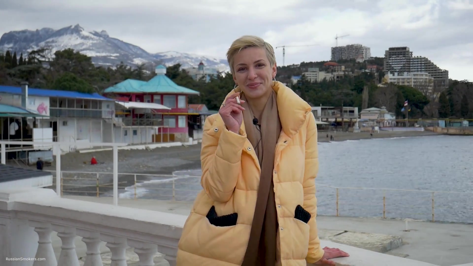 Short Cut Hair Blonde Girl Is Smoking Two Cork Cigarettes