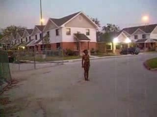 Curly black slut walks naked around the neighborhood