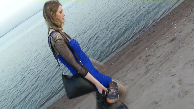 Girl in fishnets blowing