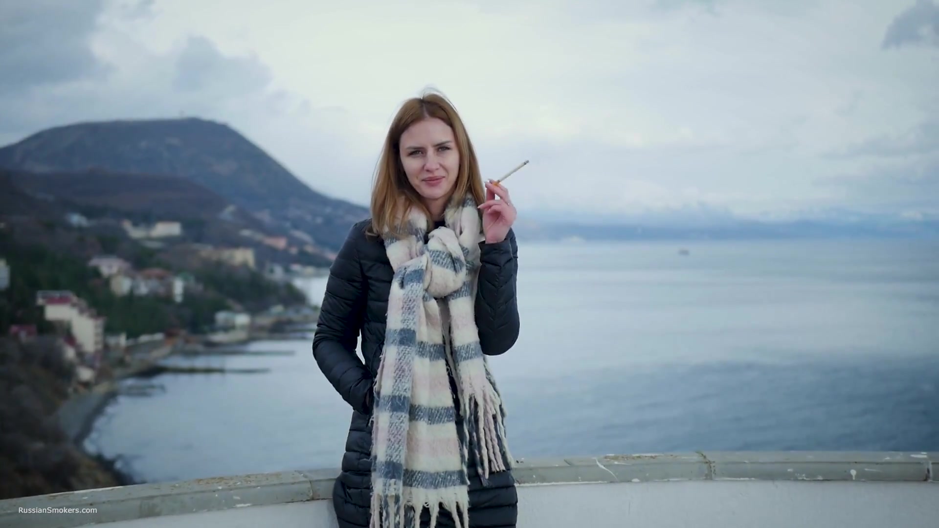 Beautiful Lady Is Smoking Two Saratoga Cigarettes In A Row On A Beautiful View
