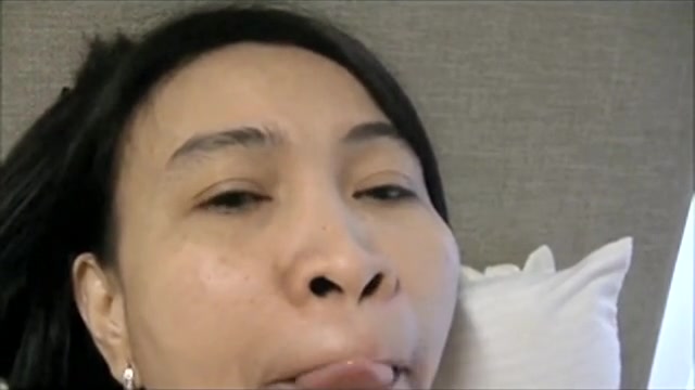 Mature Oriental woman giving a head for a facial
