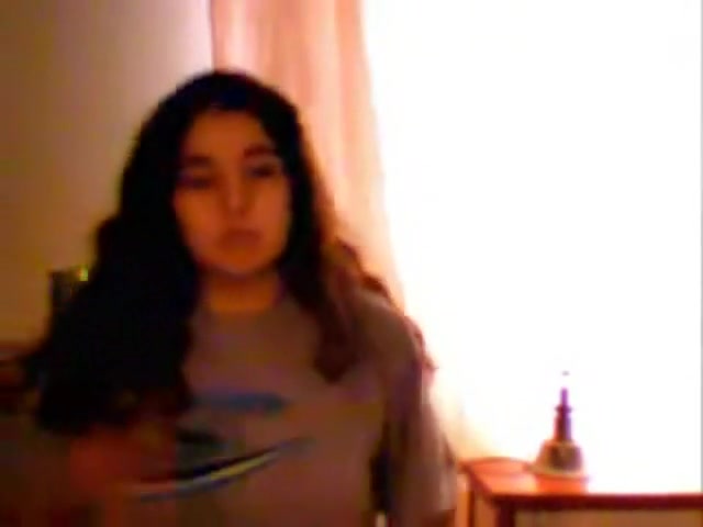 Big tittied Brazilian cutie undresses on music