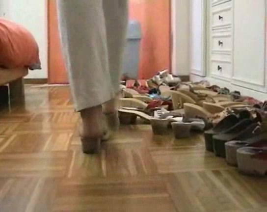 Lovely woman trys on different shoes in the foot fetish vid