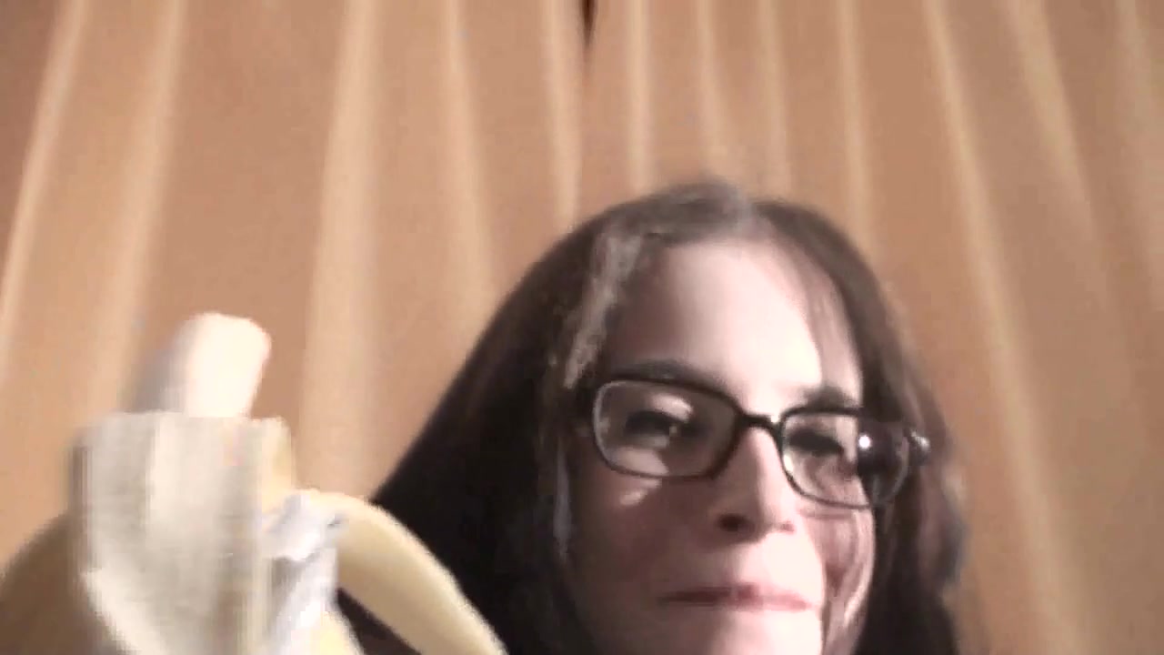 Spex brunette talking dirty while eating banana by Femdom Austria
