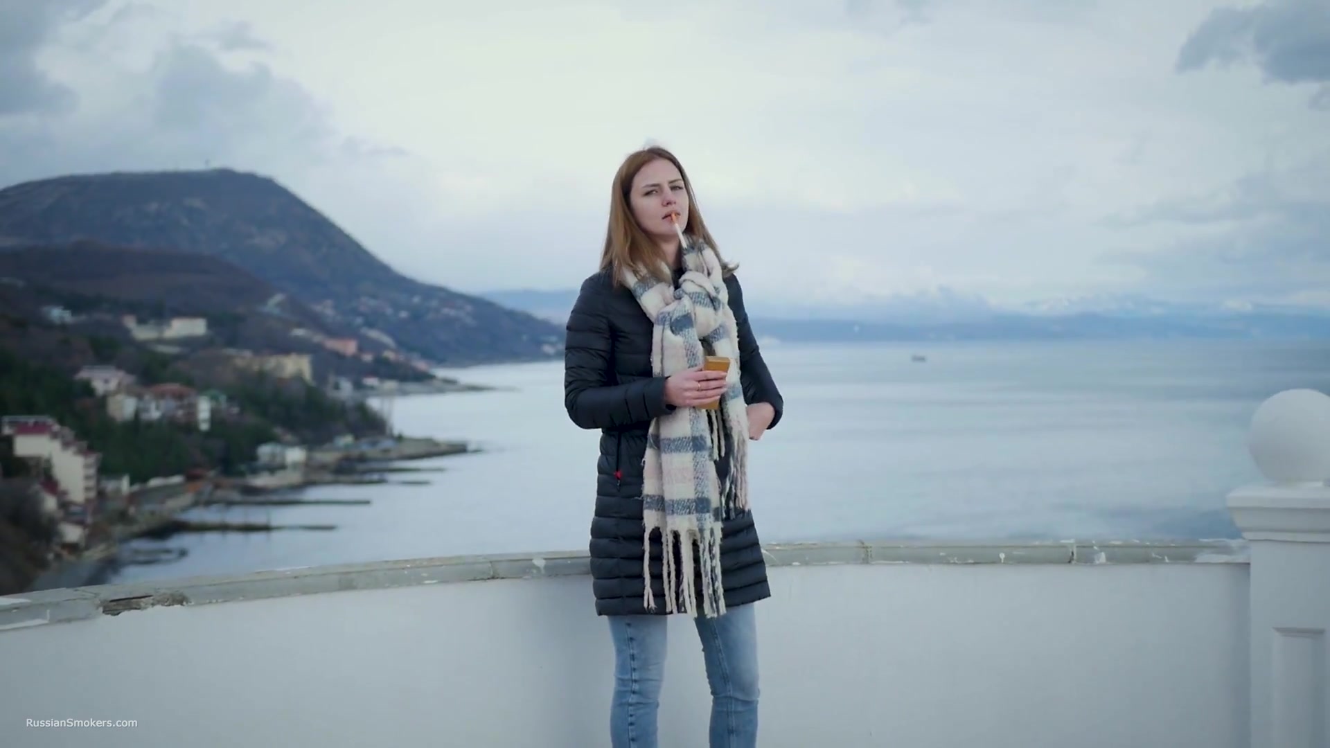 Beautiful Lady Is Smoking Two Saratoga Cigarettes In A Row On A Beautiful View