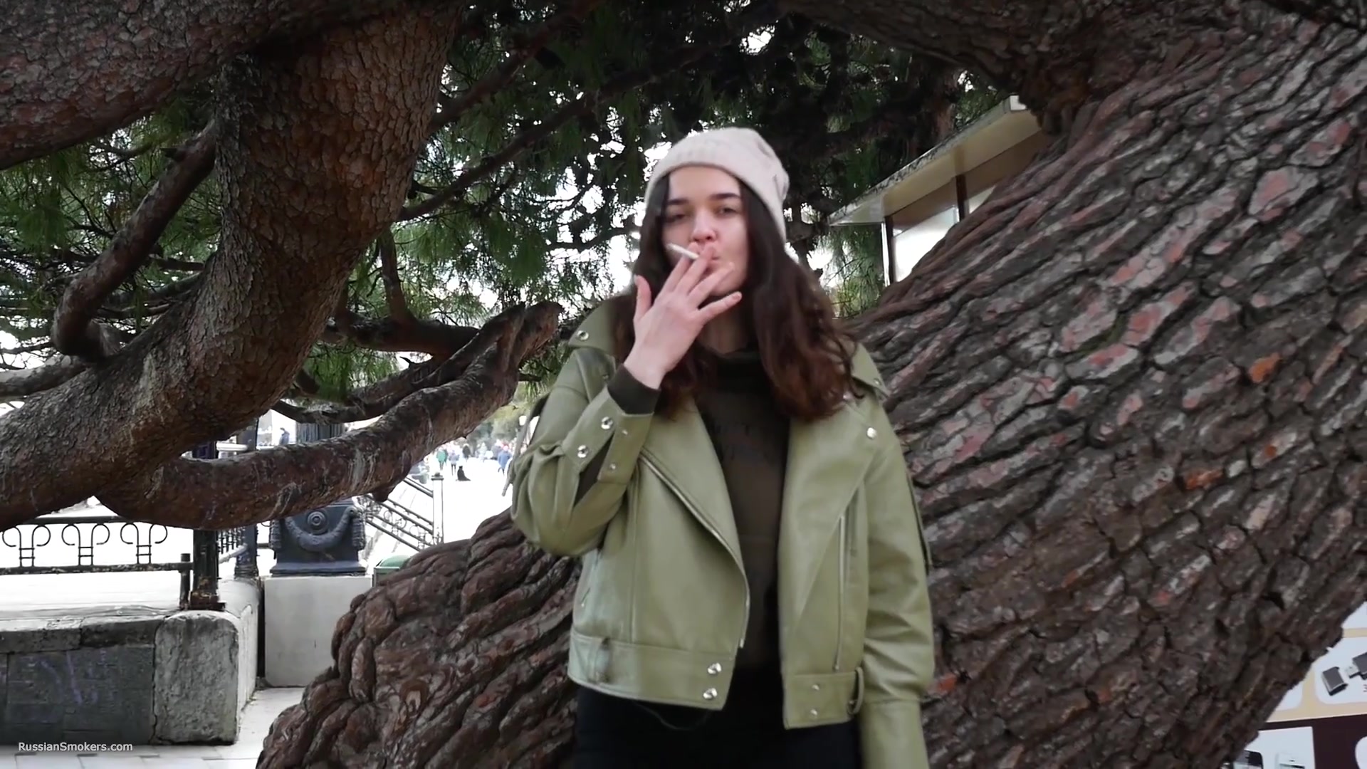 Young Brunette Is Taking An Unhurried Stroll With Allwhite 120mm Cigarette
