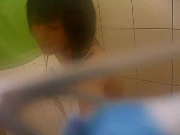 Young Asian babe caught naked in the bathroom by horny