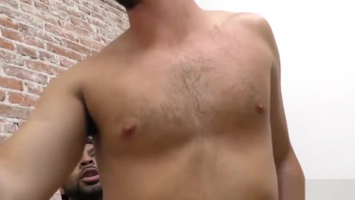 Bearded guy sucking off a black cock at a gloryhole