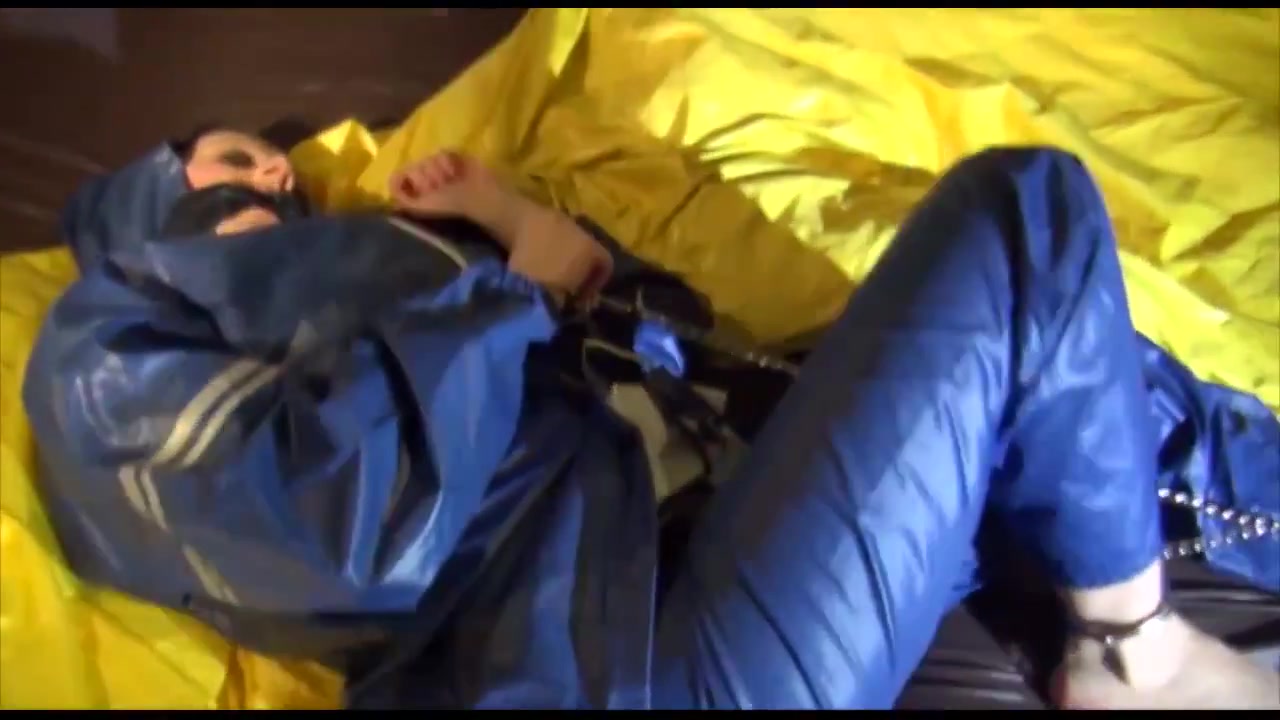 Get 2 Videos With Lucy Bound And Gagged In Her Shiny Nylon Rainwear From Our Archives