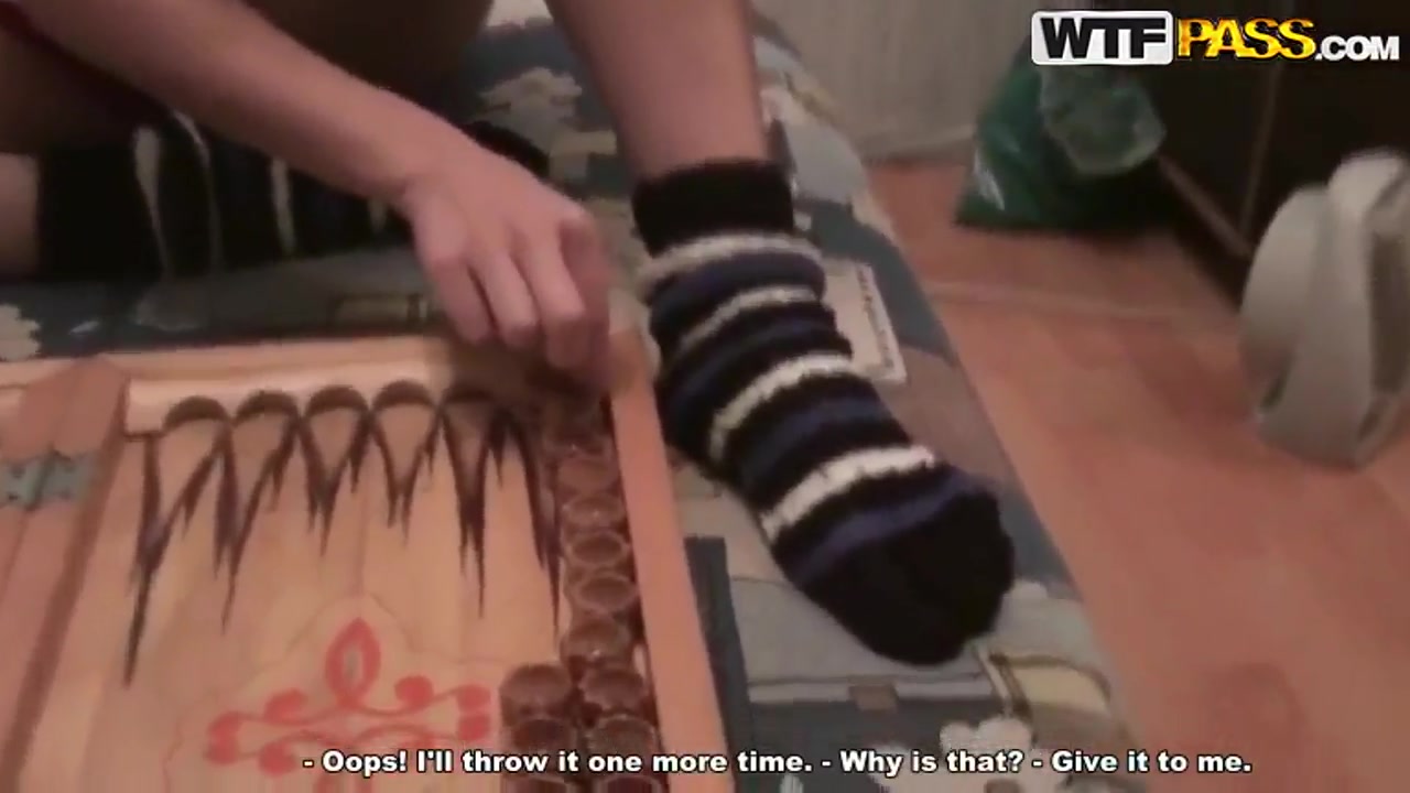 Russian girl Nastya and her classmate playing backgammon