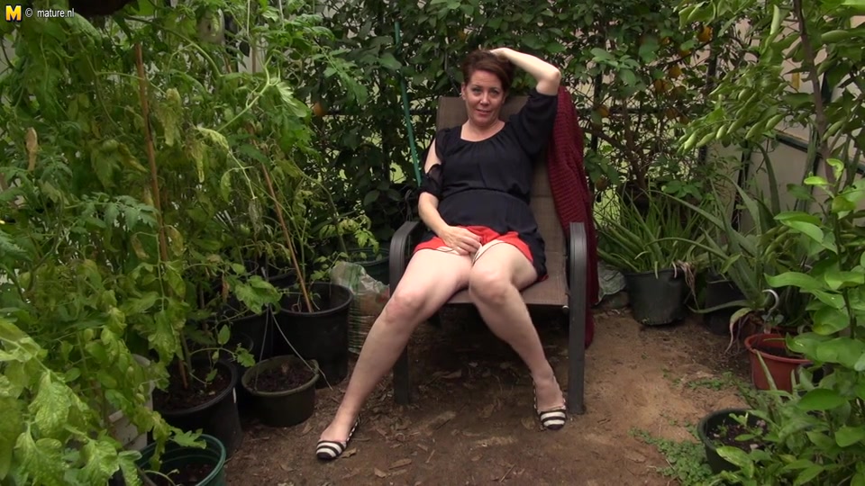 This American Cougar Gets Frisky In Her Gardenhouse - MatureNL