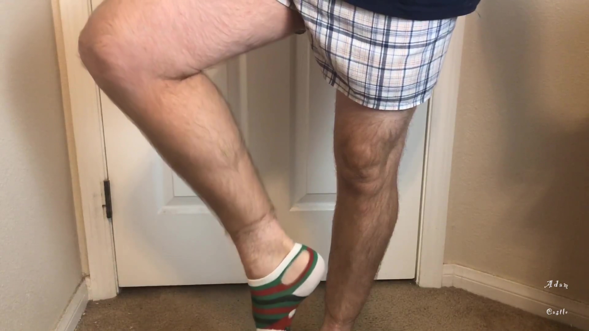 Man Does Calf Flexing With X-mas Socks