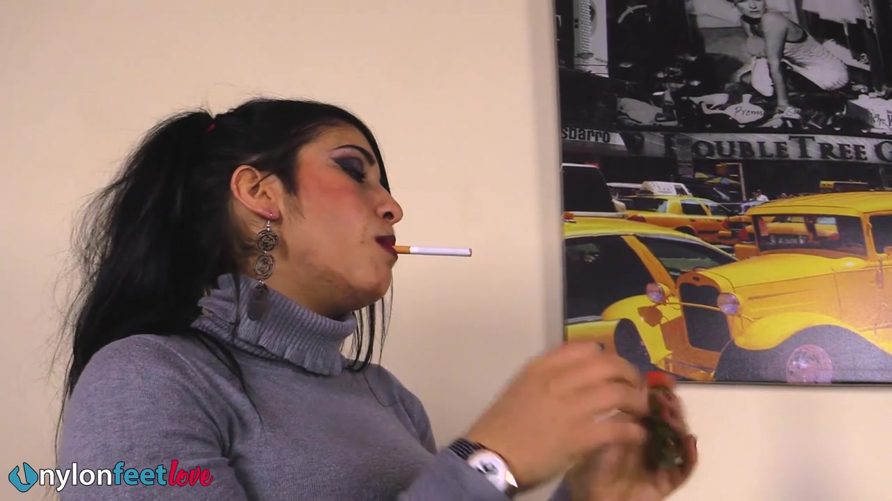 Gorgeous Sharon smoking a cigarette and showing off her nyloned feet