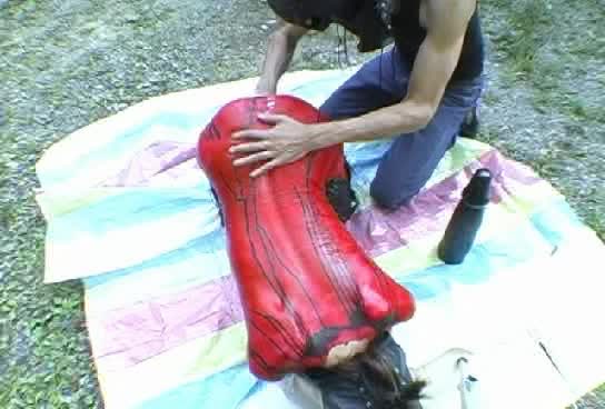 Butt toying in latex during a hike in the nature