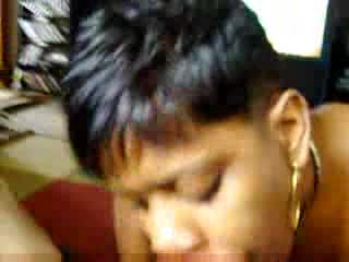 Short-haired chocolate woman tastes rod with passion