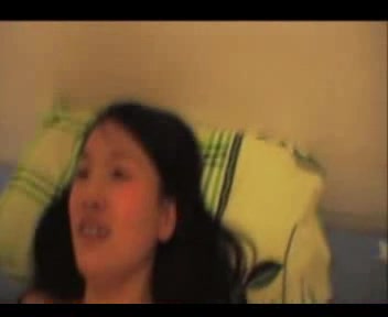 Asian girl gets her hairy pussy pounded on the bed