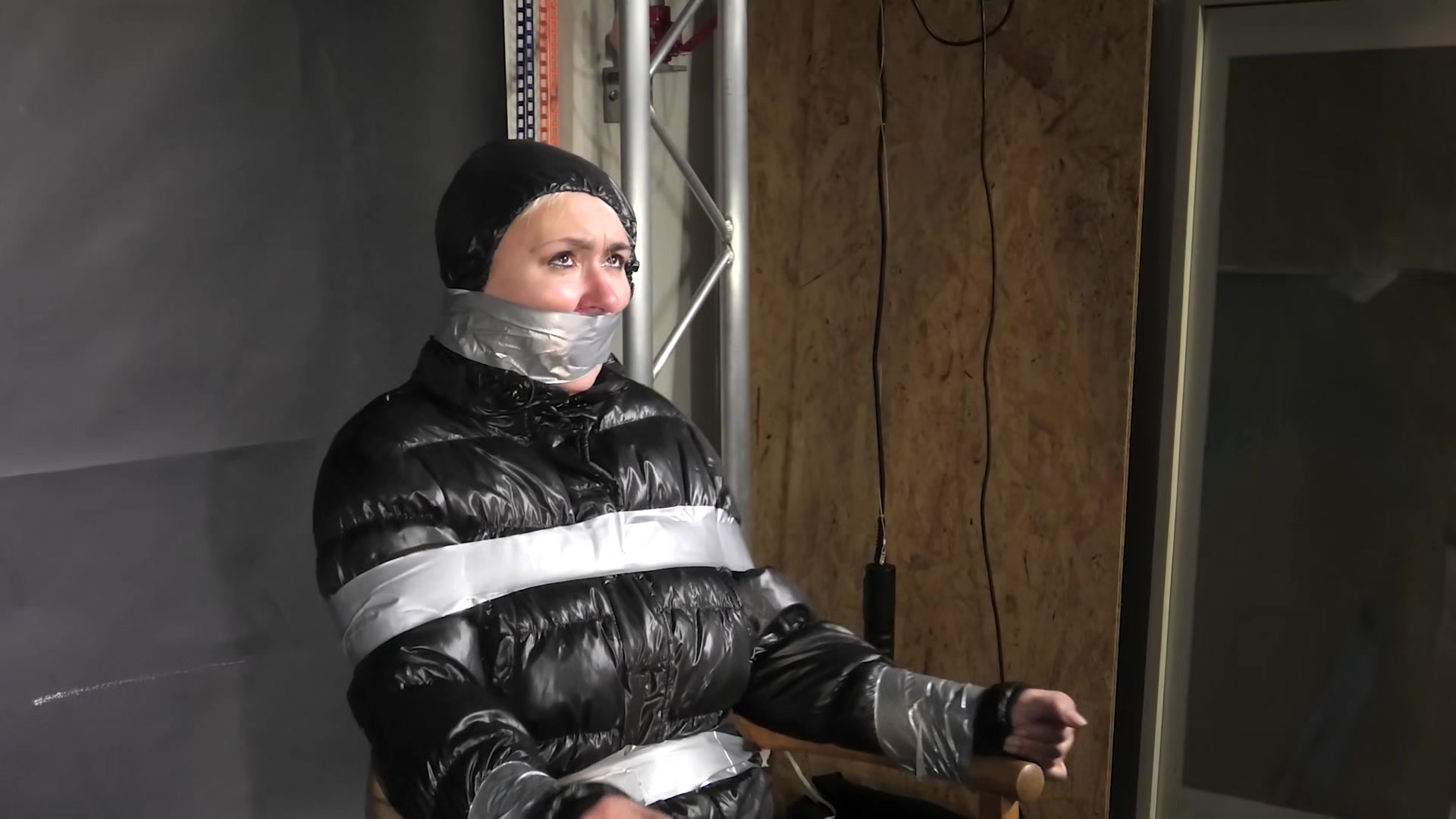 Alice Taped To A Chair And Tapegagged In Shiny Nylon Downjacket