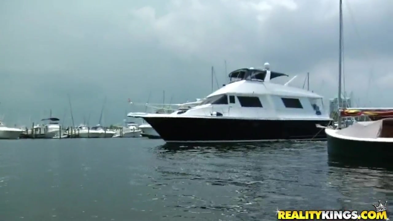 Hot ass milf reveals her tits on the boat