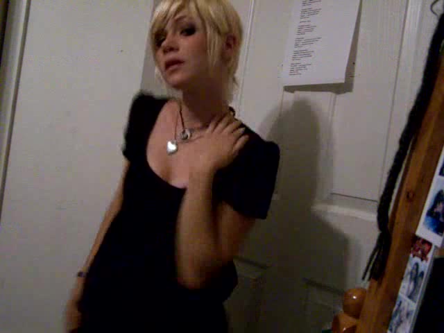 Short-haired blonde girl dances in the homemade video