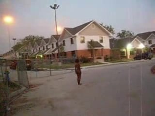 Curly black slut walks naked around the neighborhood