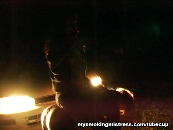 Smoking Mistress Sits on Slave