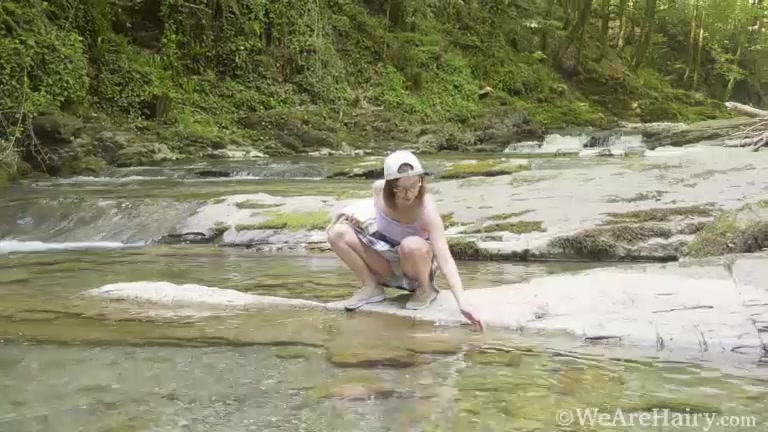 Abby strips naked by her favorite stream