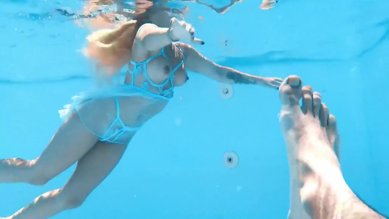 A Woman Floats In A Butterfly-adorned Mesh Dress