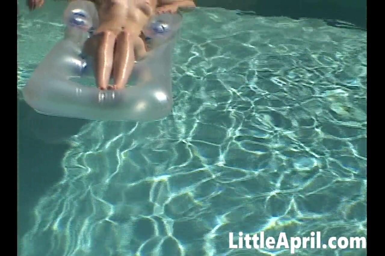 Little April fingers herself in the pool in a POV solo