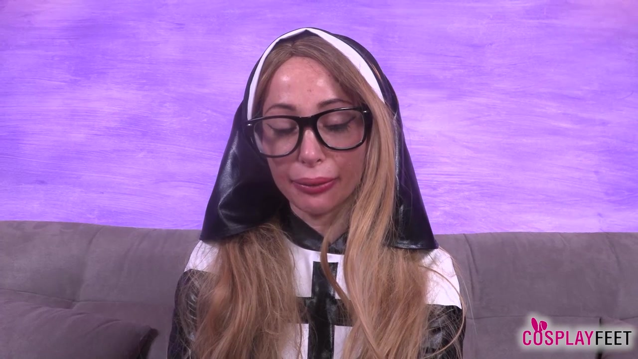 Blonde bombshell Ania as a sexy nun in black stockings