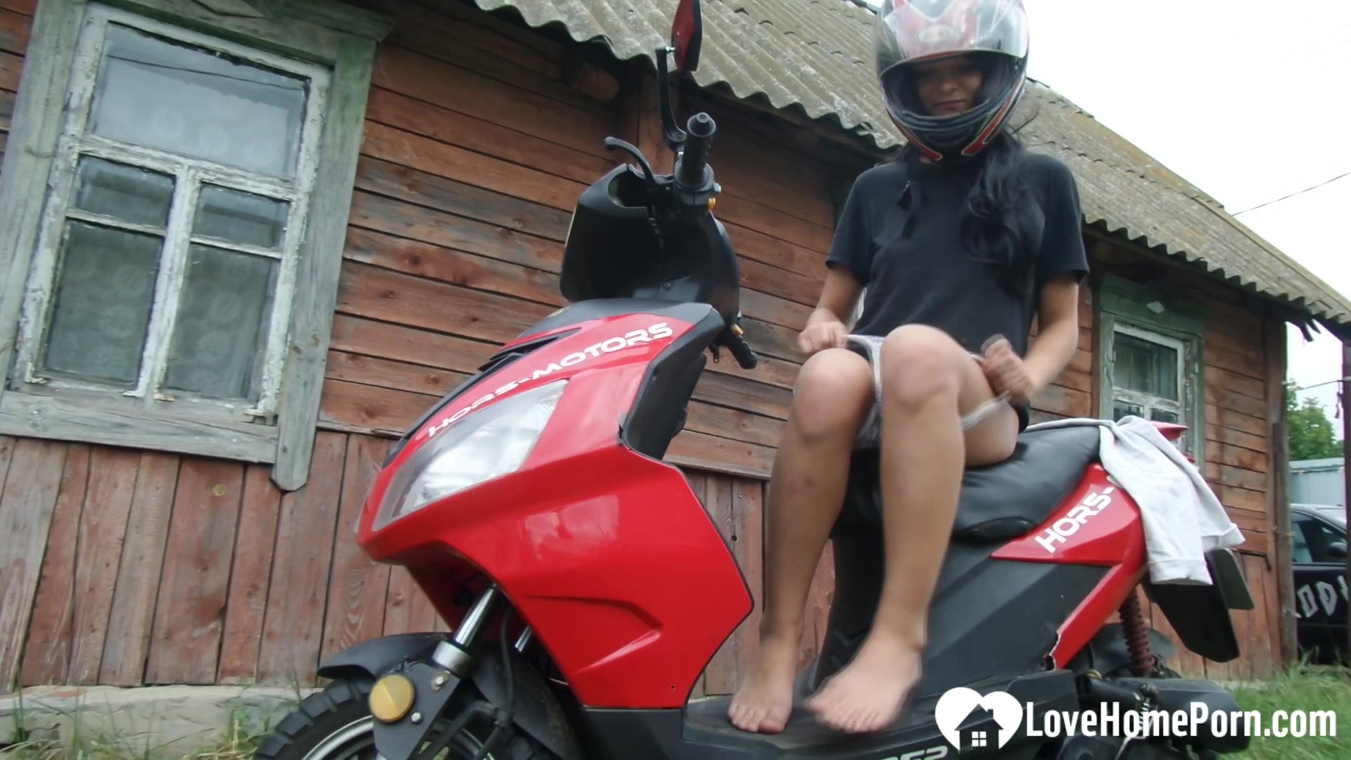 Biker girl masturbates on her red motorcycle