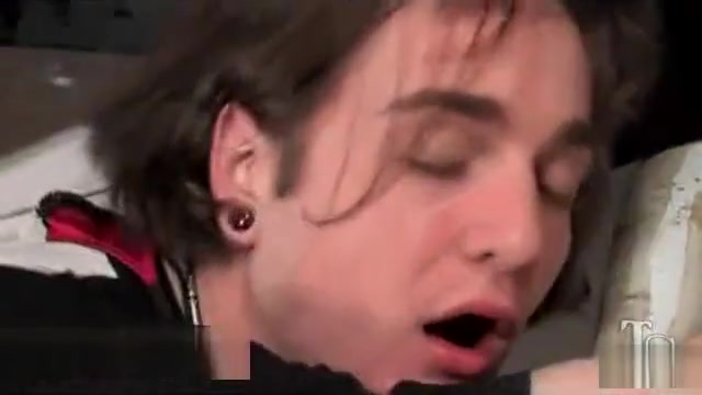 Busty tranny fucks guy in asshole in public toilet
