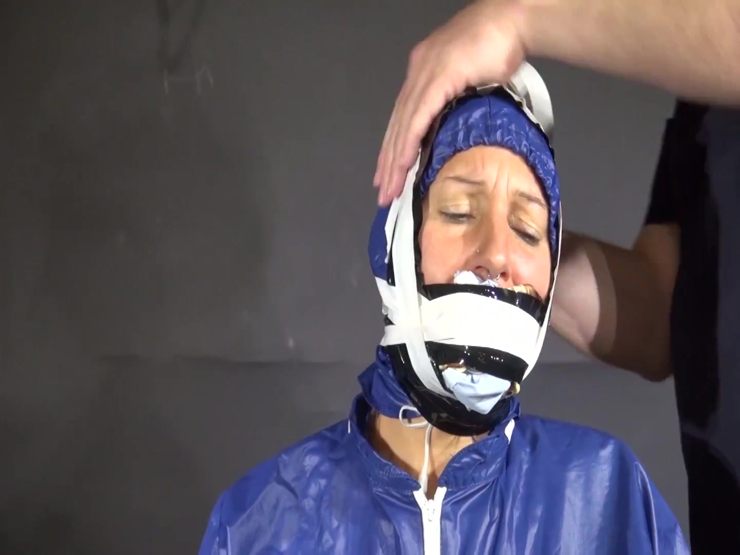Watch Sandra Beeing Bound, Pantygagged And Finally Pantyhooded In Her Shiny Nylon Rainwear