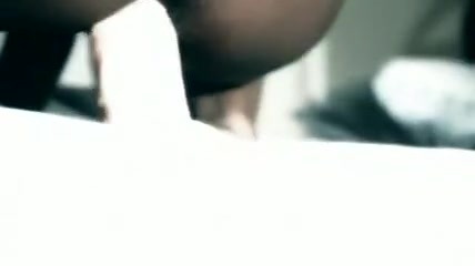 Ebony babe inserting white toys in her hairy pussy