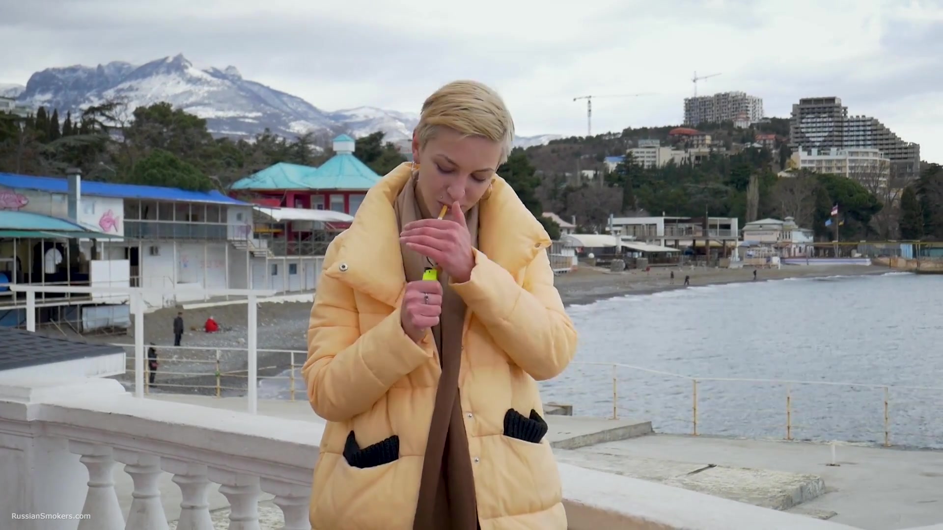 Short Cut Hair Blonde Girl Is Smoking Two Cork Cigarettes
