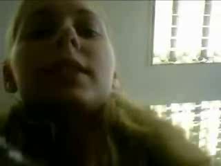 Cute blonde gal tries to shove a baseball bat in her pussy