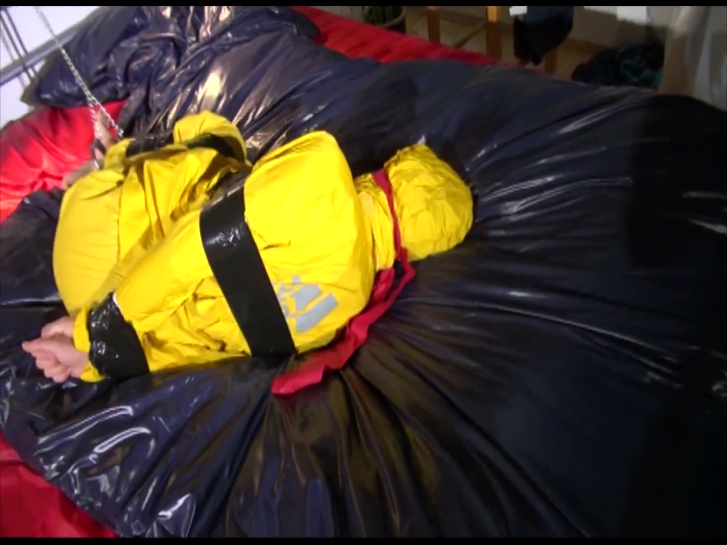 Get 2 Archivevideos With Sonja Enjoying Bondage In Her Shiny Nylon Rainwear