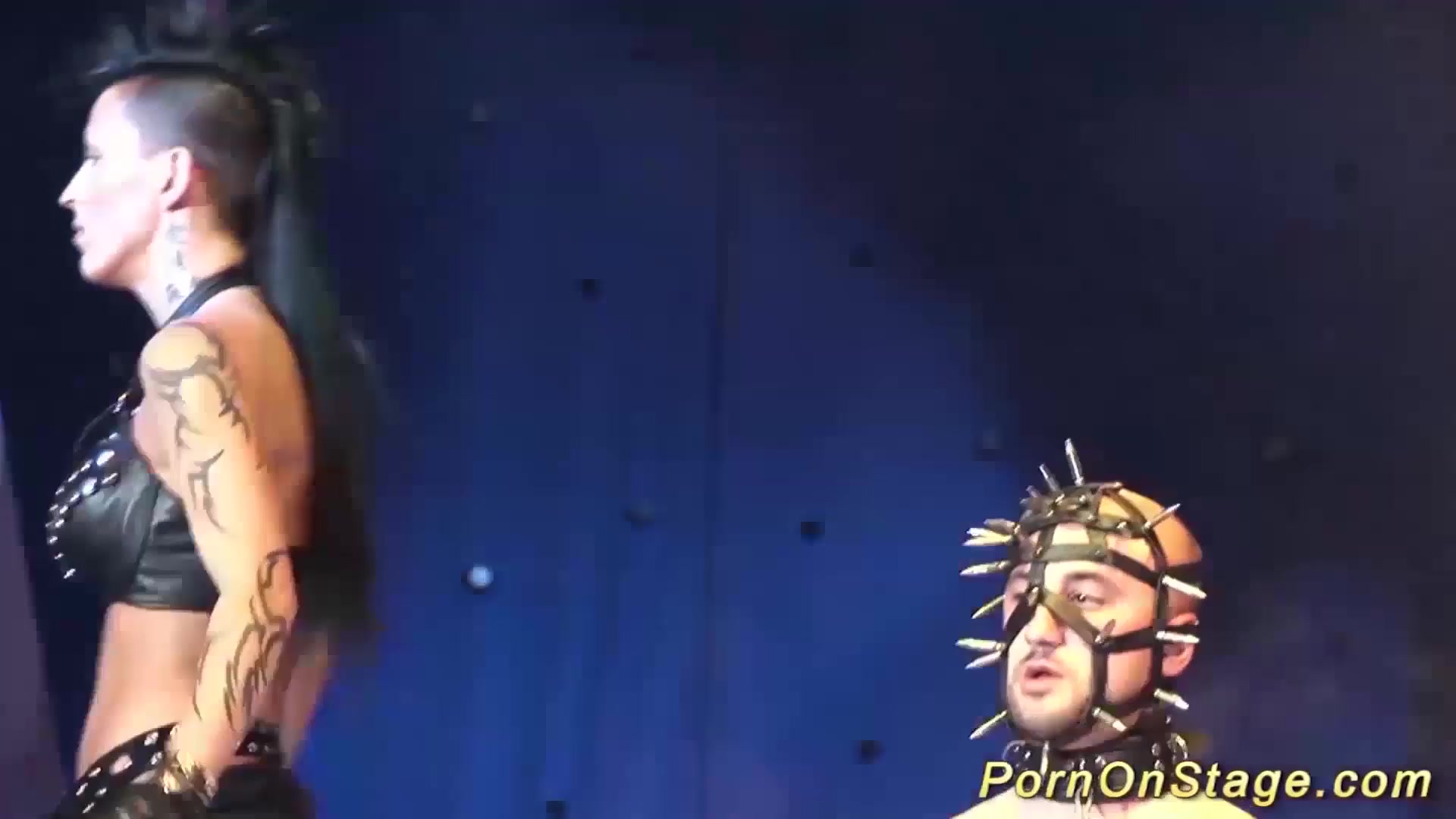 extreme fetish show on public show stage