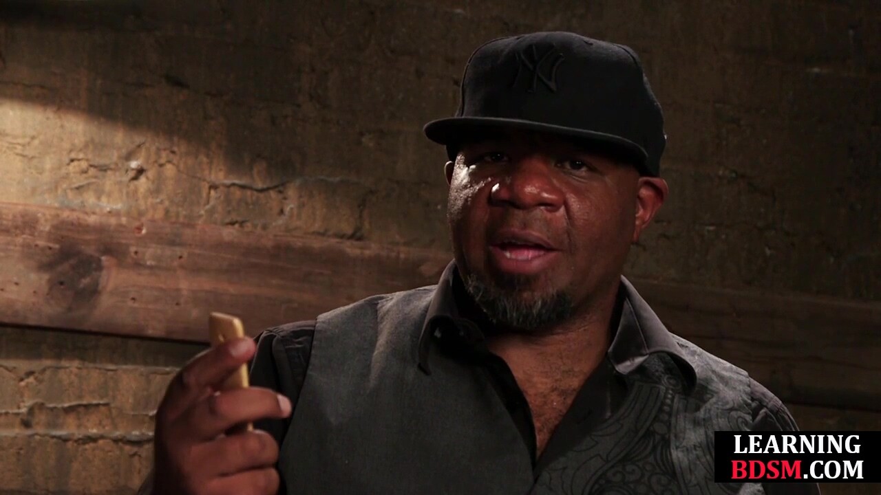 Instructor explaining BDSM with toys on a hot latina babe
