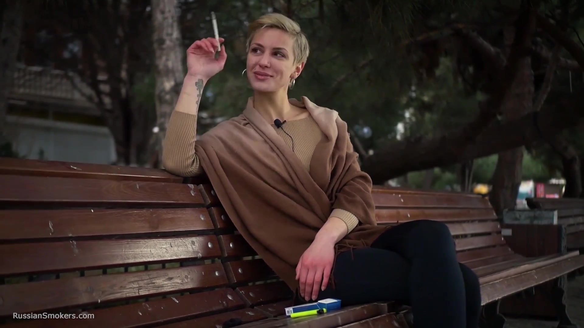 Short Cut Hair Blonde Girl Is Smoking All White 120mm Cigarettes