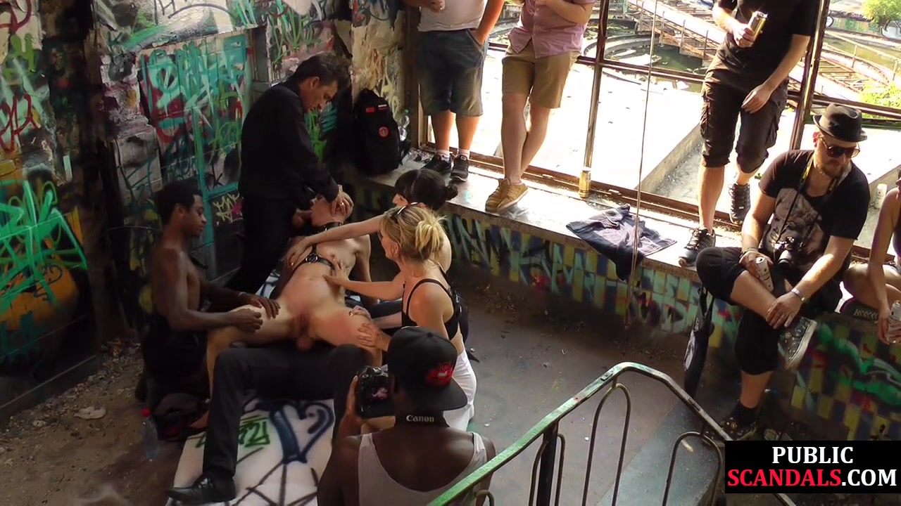 Bald slut in leather harness 3way DP fucked in public