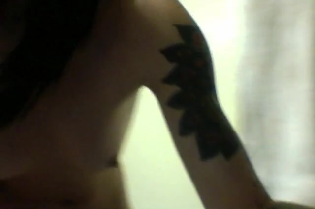 Dark-haired tattooed chick masturbating on webcam