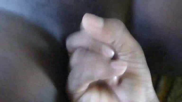 Black skinned girl has something inside her pussy