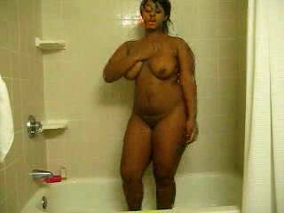 Ebony bitch with curves washes her brown twat in the shower