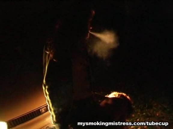Smoking Mistress Sits on Slave